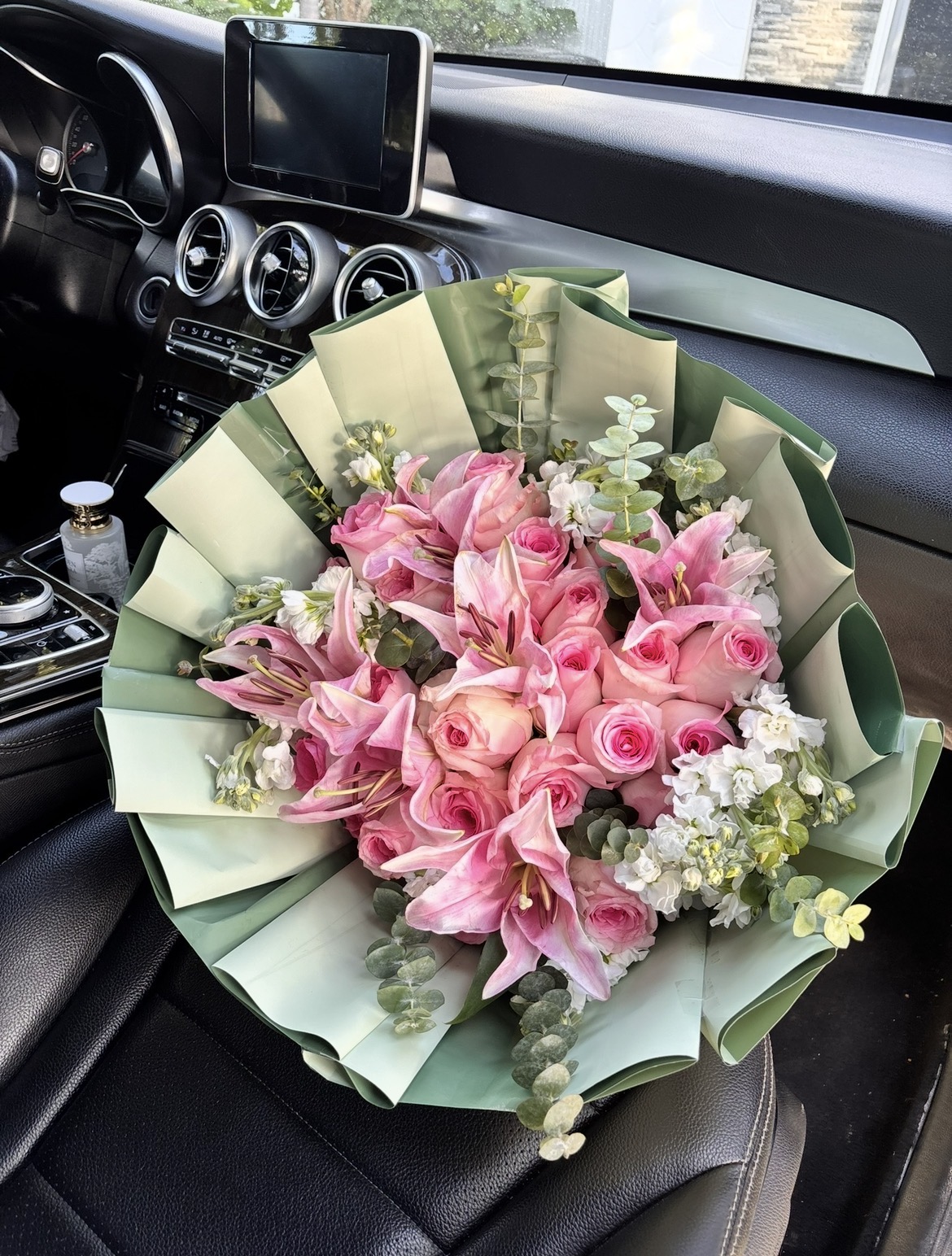 Oversized bouquet of coral roses and pink hydrangeas